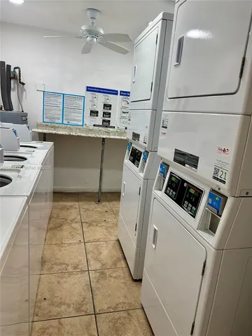 a kitchen with a sink and a stove top oven