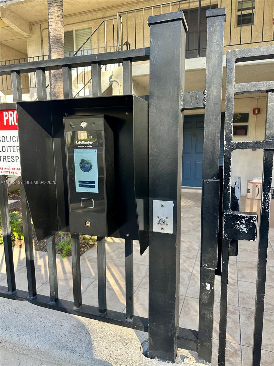 8605 Southwest 68th Court, Unit 26 Pinecrest, FL 33156 - Photo 18 of 21 a picture of a building with a glass door