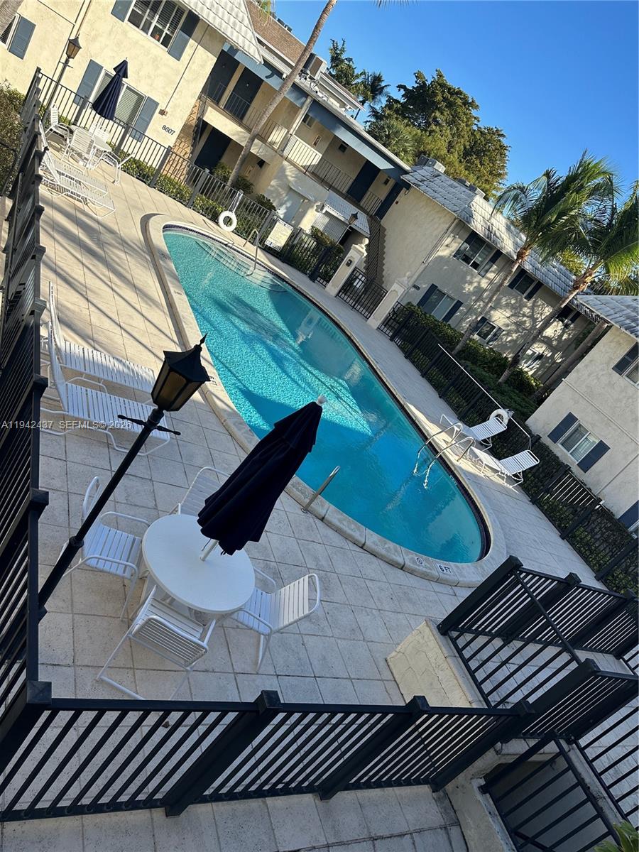 8605 Southwest 68th Court, Unit 26 Pinecrest, FL 33156 - Photo 20 of 21 a view of outdoor sitting area with furniture