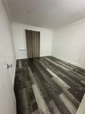 a view of a livingroom with wooden floor
