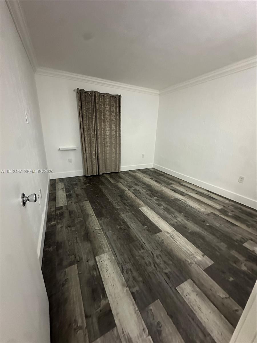 8605 Southwest 68th Court, Unit 26 Pinecrest, FL 33156 - Photo 8 of 21 a view of a livingroom with wooden floor