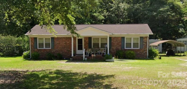 404 Hammond Street Heath Springs, SC 29058 - Photo 1 of 1 a front view of a house with a yard
