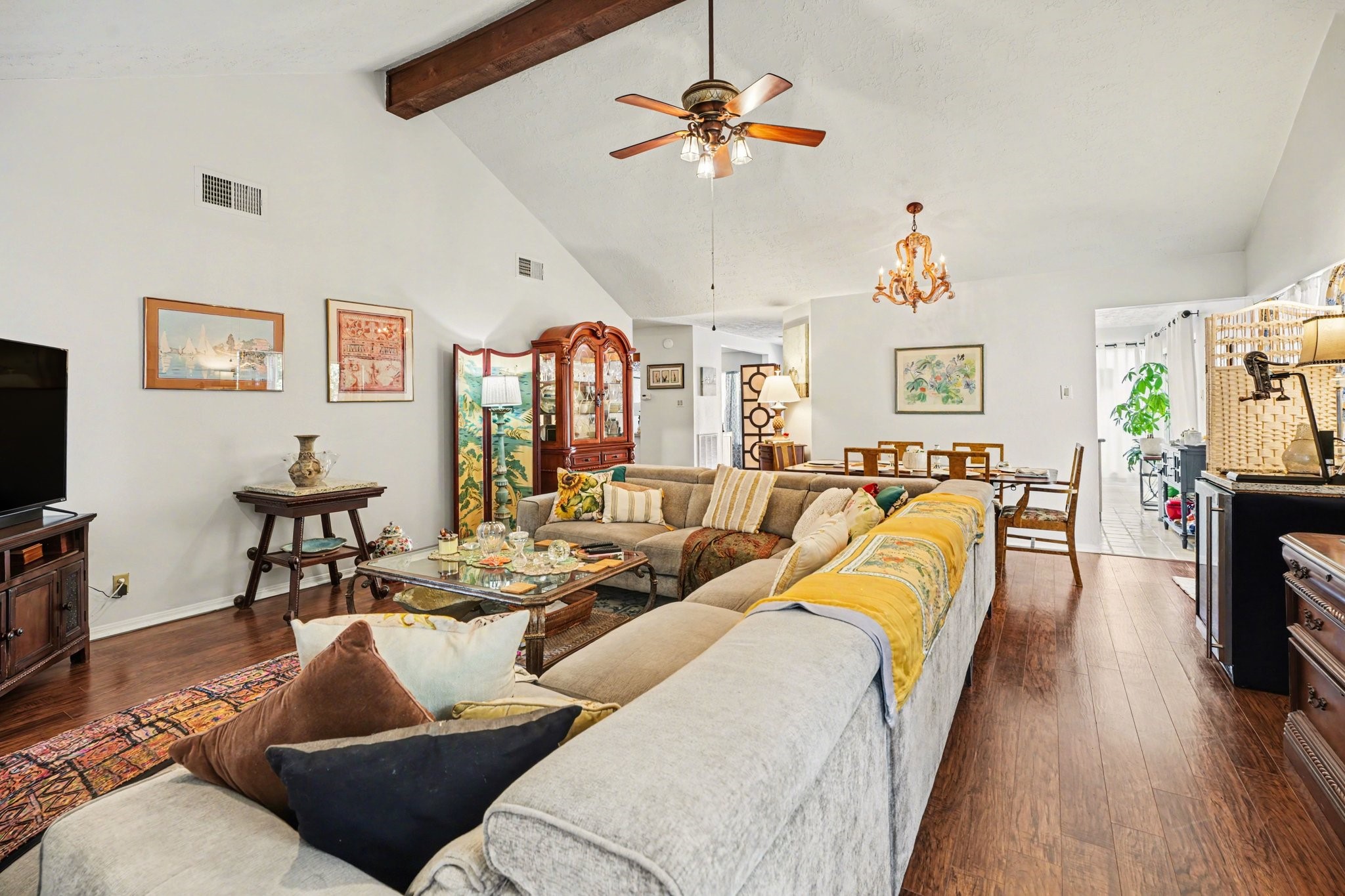 16810 Finewood Way Houston, TX 77058 - Photo 11 of 23 Spacious living room with laminate wood flooring, offering ample room for an oversized sectional