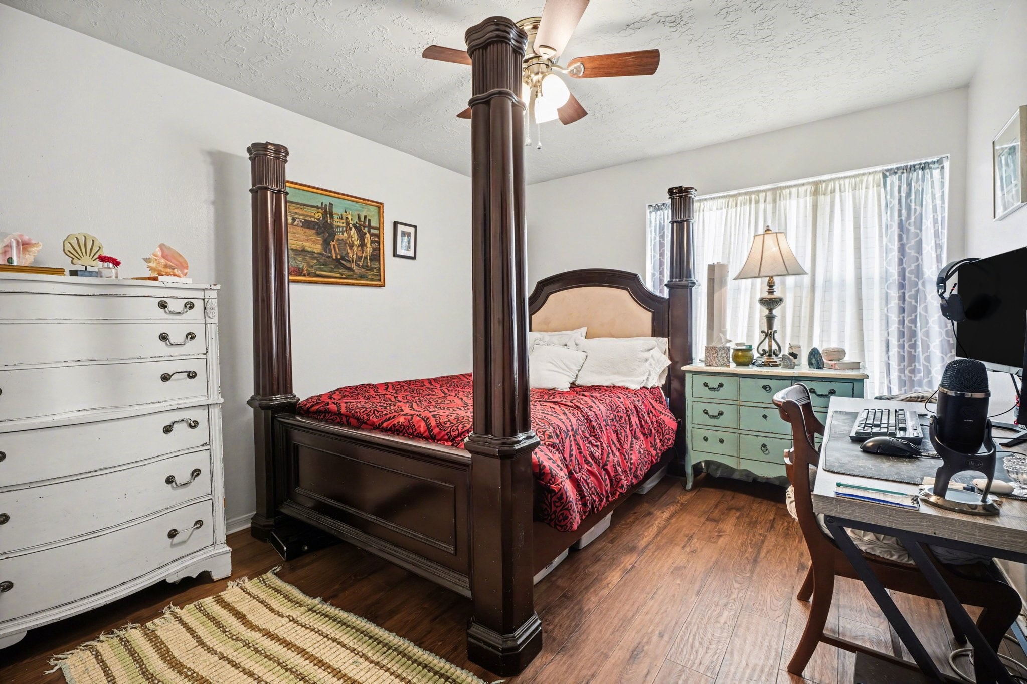 16810 Finewood Way Houston, TX 77058 - Photo 19 of 23 Secondary bedroom offers plenty of space for larger furniture and features updated flooring with a bright, airy feel.
