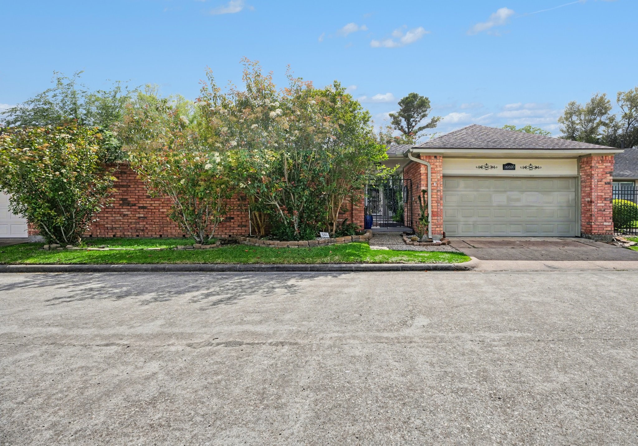 16810 Finewood Way Houston, TX 77058 - Photo 2 of 23 Charming curb appeal with lush landscaping and a roof replaced in 2017.