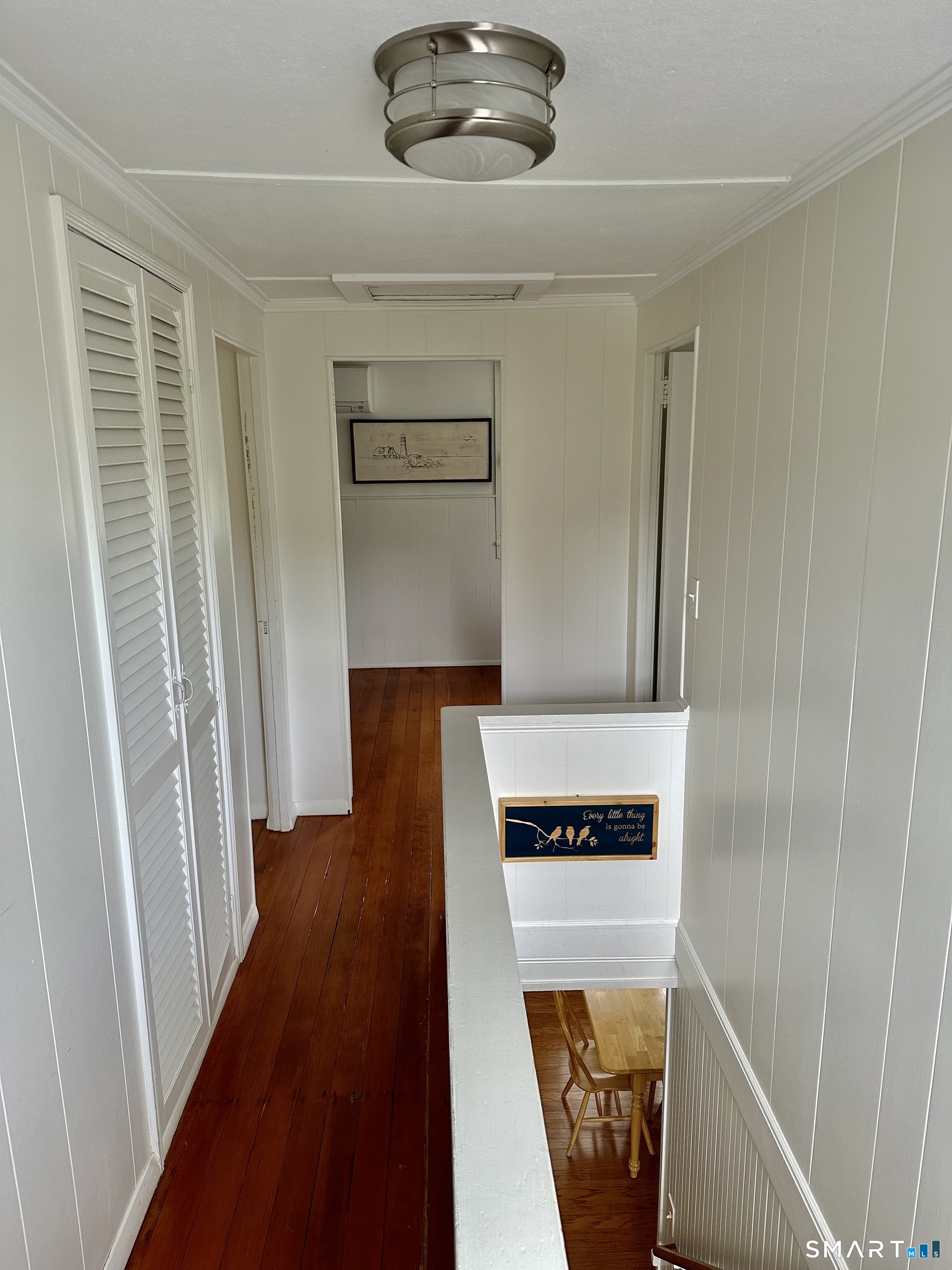 36 Attawan Road East Lyme, CT 06357 - Photo 24 of 40 Hardwood Floors throughout! Primary Bedroom to the Left after Linen Closet. Main Bath to the Left in this photo. 3rd Bedroom Straight Ahead, 2nd Bedroom to the Right.