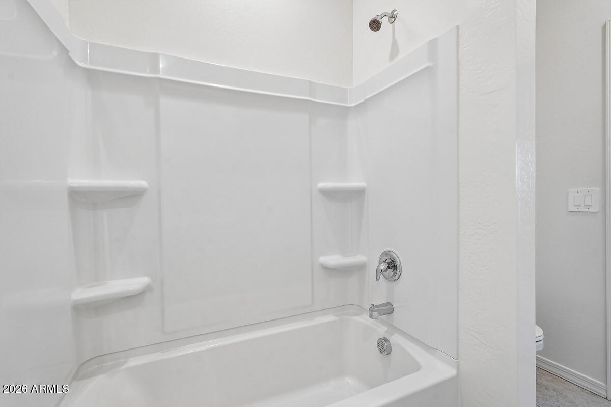 31690 Rodeo Road San Tan Valley, AZ 85140 - Photo 10 of 35 a bathroom with a bathtub