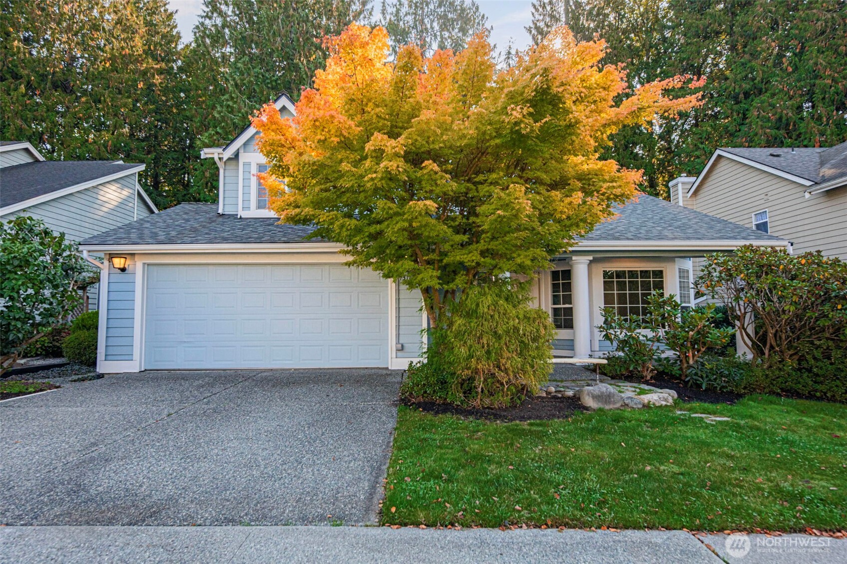 13117 Tonga Ridge Road Southeast Monroe, WA 98272 - Photo 1 of 40 a front view of a house with a garden