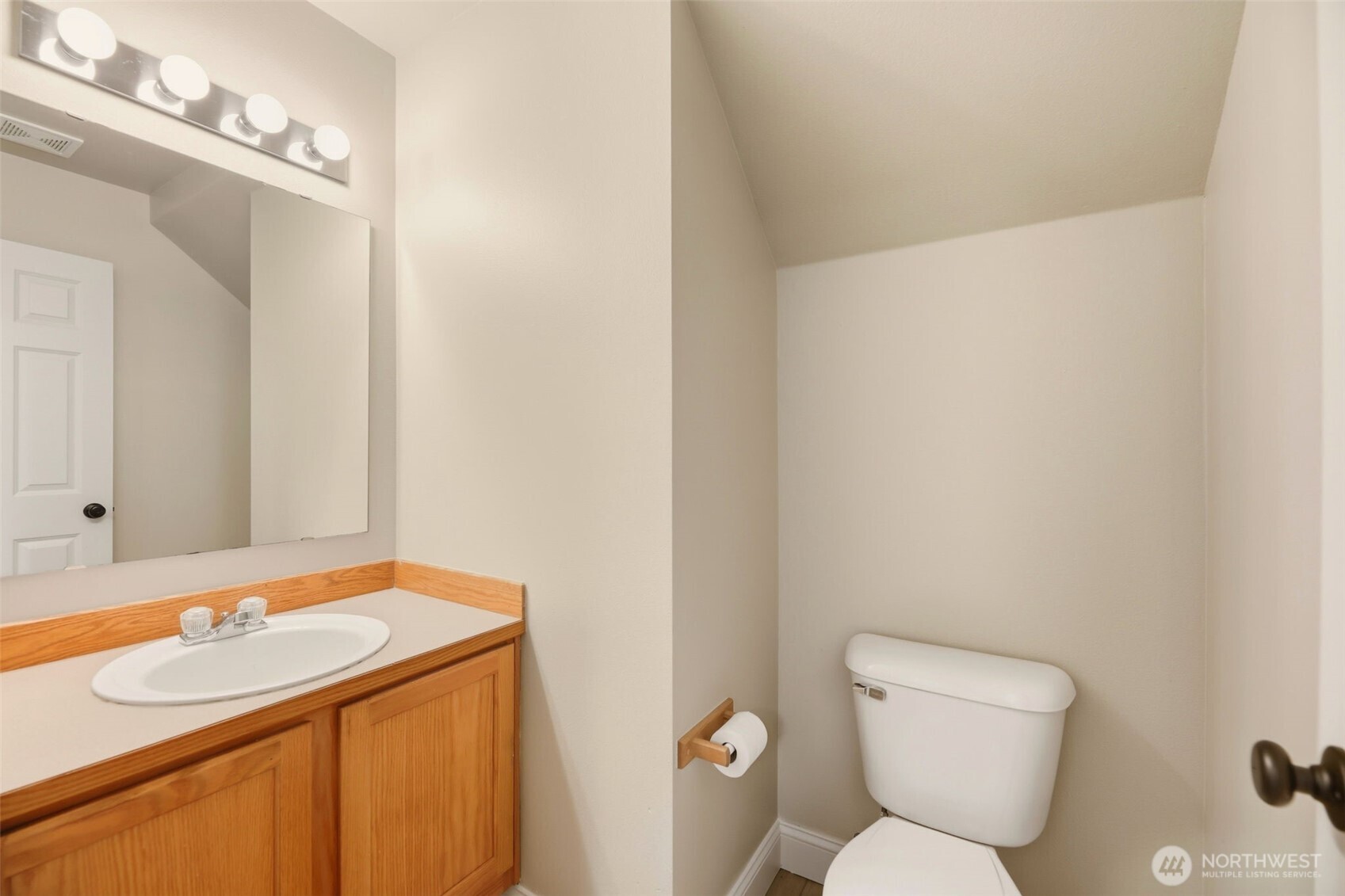 13117 Tonga Ridge Road Southeast Monroe, WA 98272 - Photo 26 of 40 a bathroom with a sink toilet and a mirror