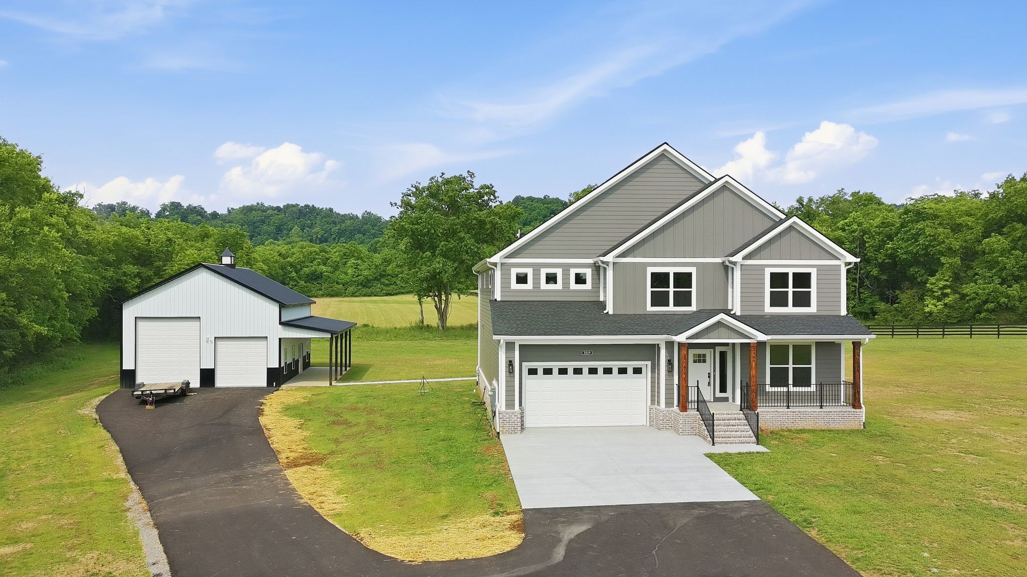 3319 Booker Ridge Road Mount Pleasant, TN 38474 - Photo 2 of 51 a front view of a house with a yard