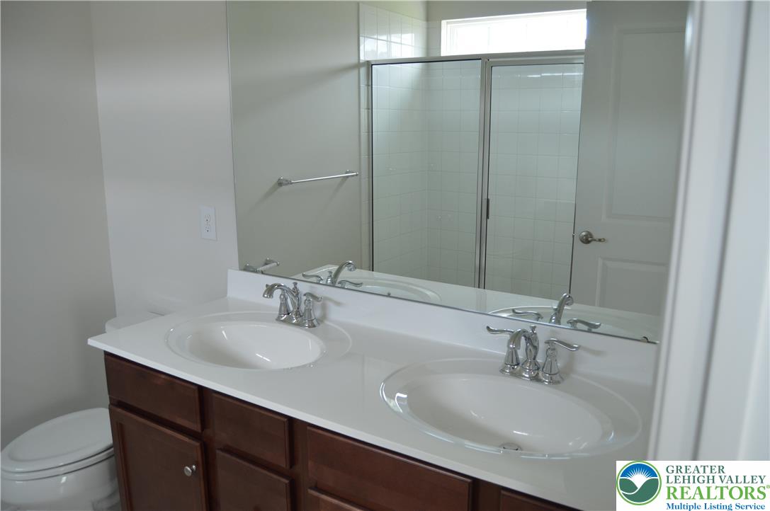 2332 Raya Way Easton, PA 18045 - Photo 10 of 14 a bathroom with a sink and a mirror