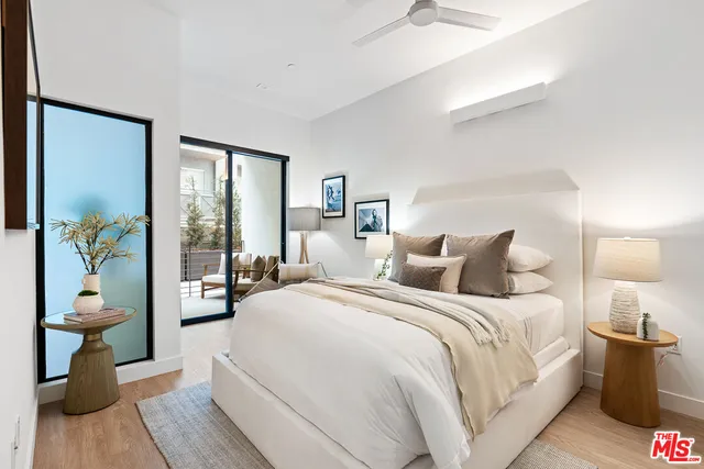 a bathroom with a toilet a sink a shower and mirror