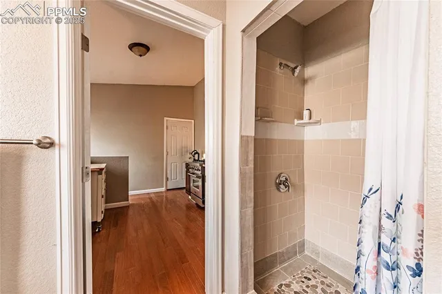 a bathroom with a tub and shower