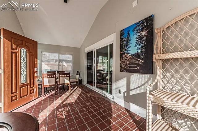 a bed room with a bed and a large window