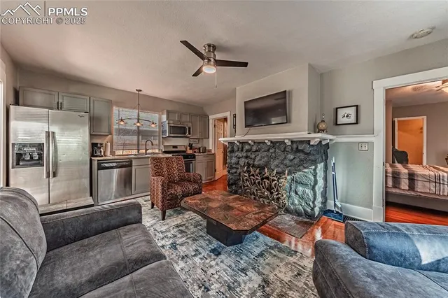 a living room with furniture and a fireplace