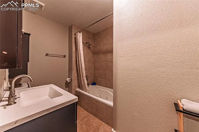 a bathroom with a sink and mirror