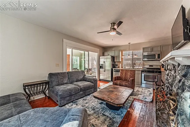 a living room with furniture and a fireplace
