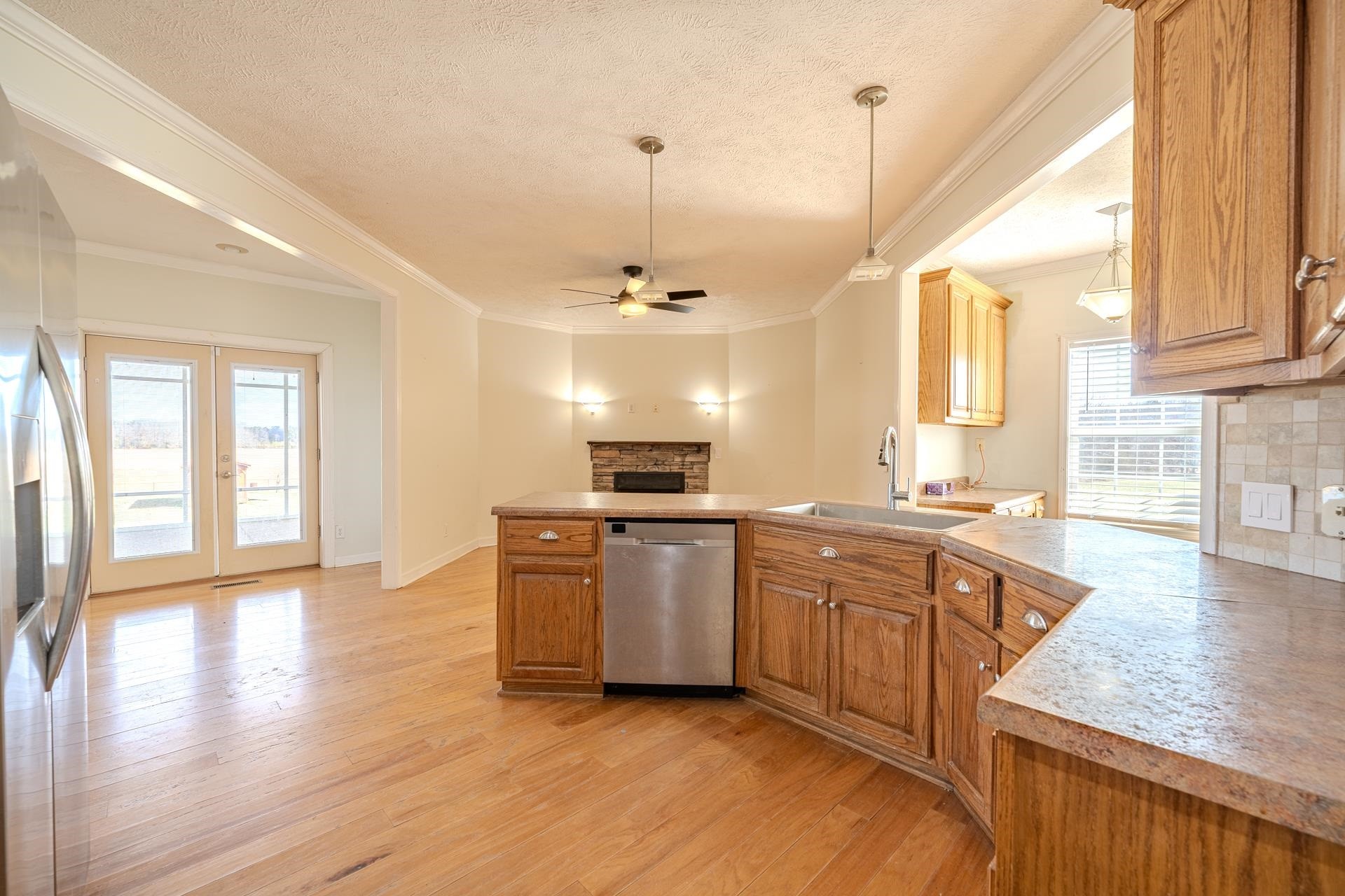 185 Leath Lane Finger, TN 38334 - Photo 11 of 34 a large kitchen with granite countertop a stove and a sink