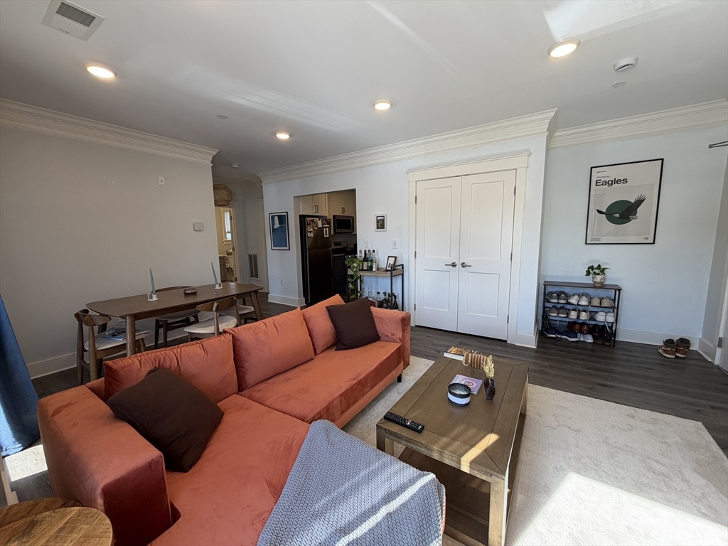 17 Hennery Way, Unit G Medfield, MA 02052 - Photo 4 of 12 a living room with furniture and a couch