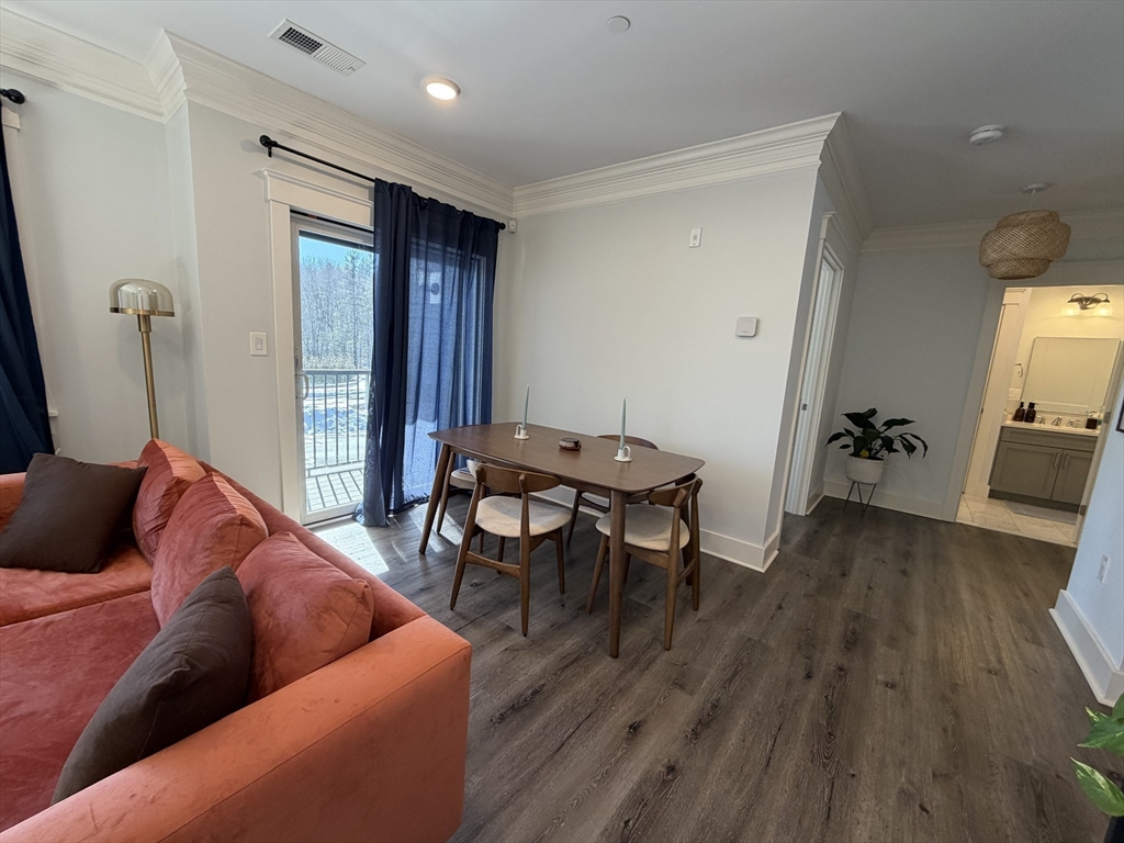 17 Hennery Way, Unit G Medfield, MA 02052 - Photo 5 of 12 a living room with furniture and a wooden floor