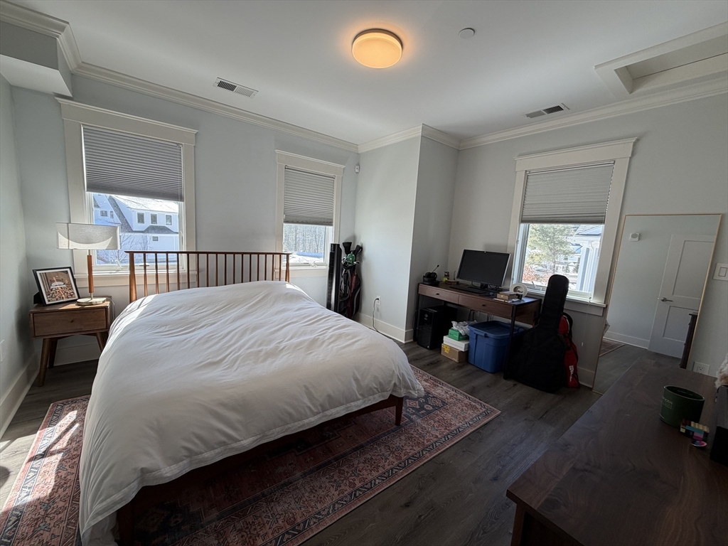 17 Hennery Way, Unit G Medfield, MA 02052 - Photo 9 of 12 a bed room with a bed and a chair