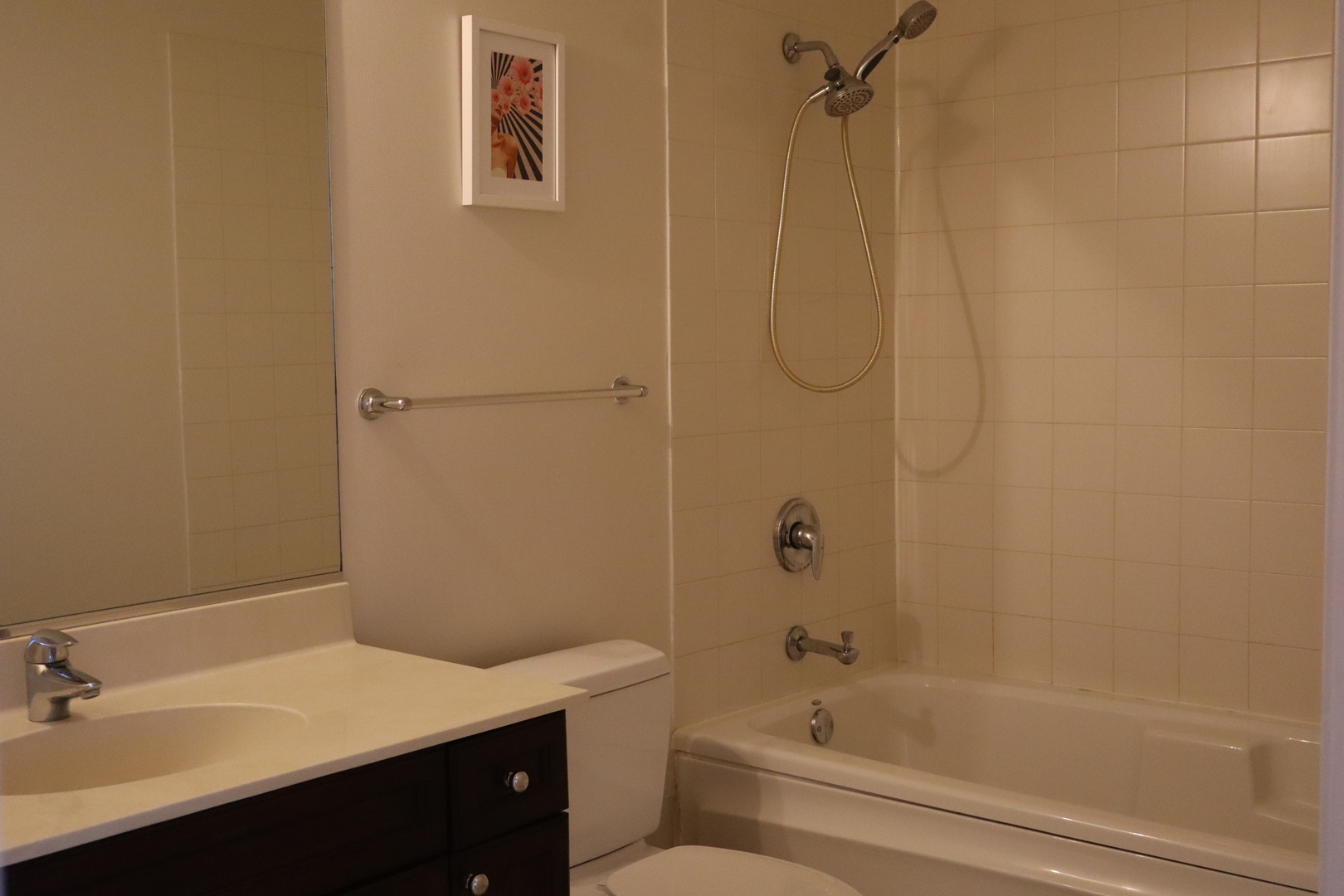 1250 South Michigan Avenue, Unit 1306 Chicago, IL 60605 - Photo 13 of 24 a bathroom with a bathtub sink vanity and toilet