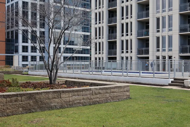 a view of a building with a yard