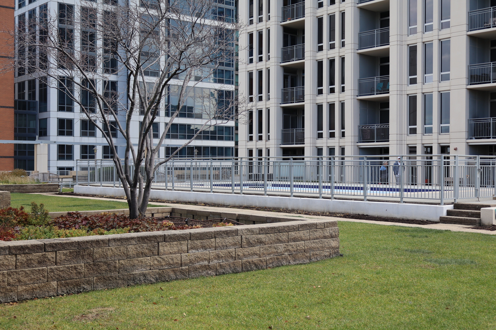 1250 South Michigan Avenue, Unit 1306 Chicago, IL 60605 - Photo 20 of 24 a view of a building with a yard
