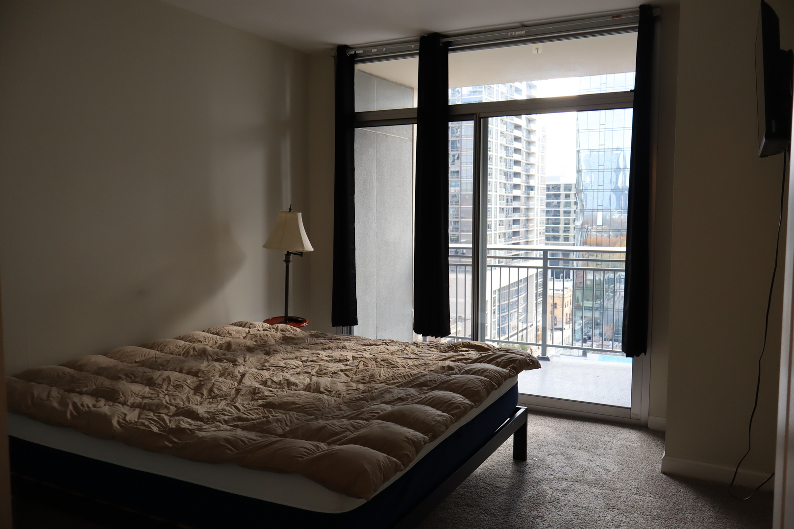 1250 South Michigan Avenue, Unit 1306 Chicago, IL 60605 - Photo 7 of 24 a bedroom with a bed and a window