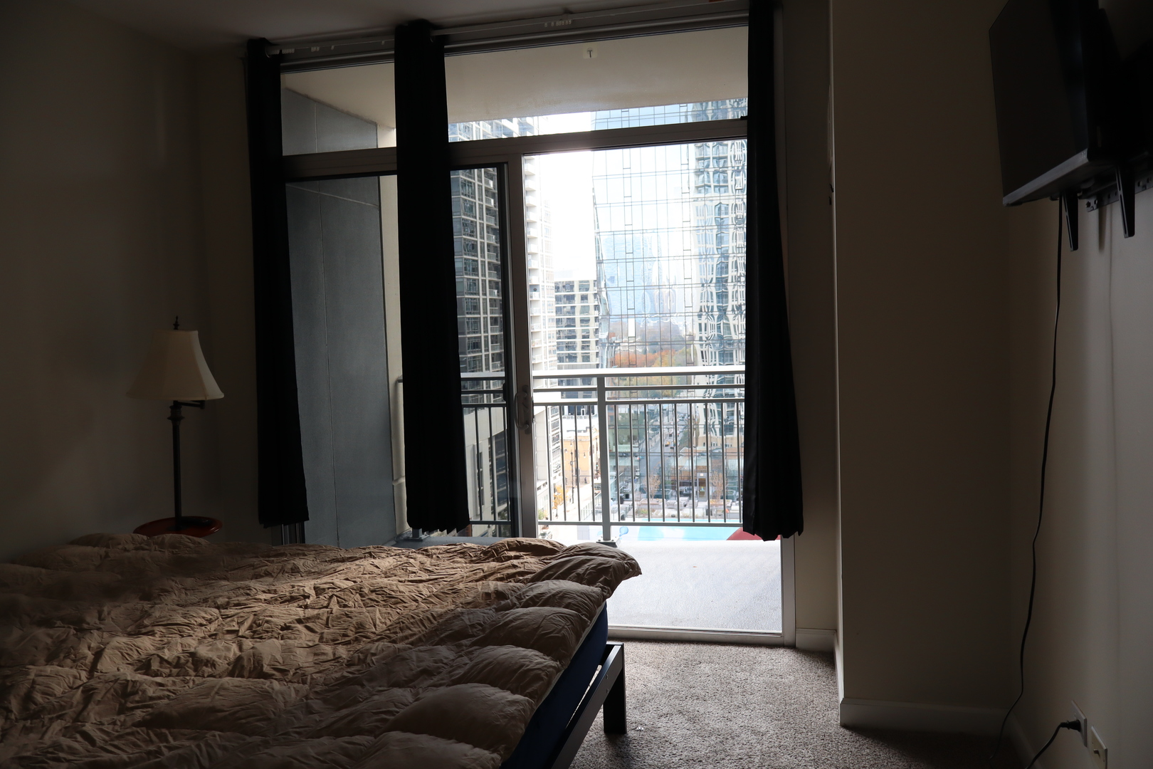 1250 South Michigan Avenue, Unit 1306 Chicago, IL 60605 - Photo 8 of 24 a bedroom with a bed and a window