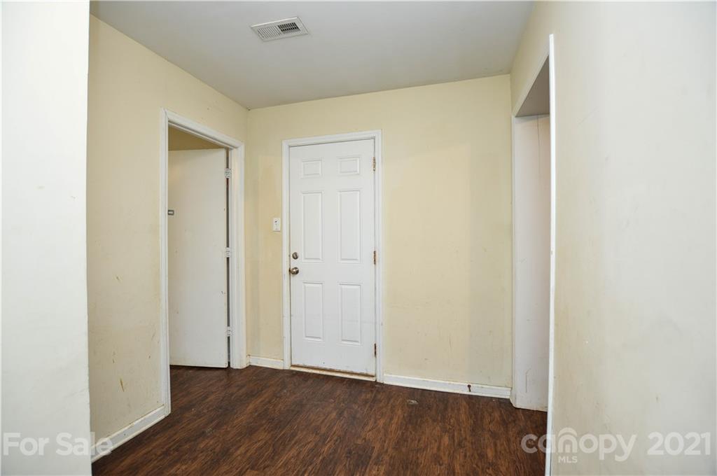 807 Squirrel Hill Road Charlotte, NC 28213 - Photo 15 of 34 a view of an empty room with wooden floor