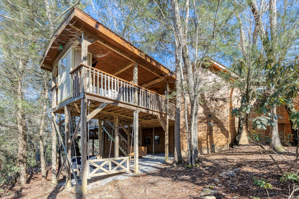 586 Newport Road Blue Ridge, GA 30513 - Photo 2 of 38 a view of a house with large trees