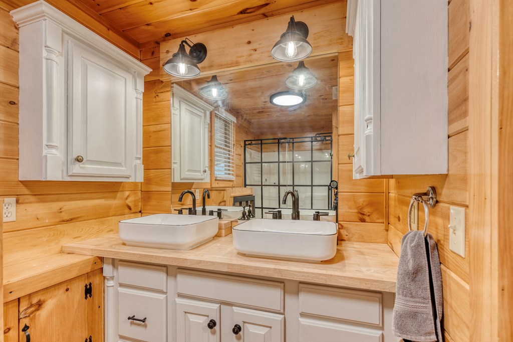 586 Newport Road Blue Ridge, GA 30513 - Photo 26 of 38 a bathroom with a sink and a mirror