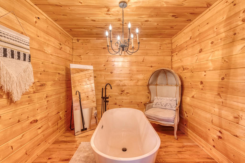 586 Newport Road Blue Ridge, GA 30513 - Photo 27 of 38 a bathroom with a sink and mirror