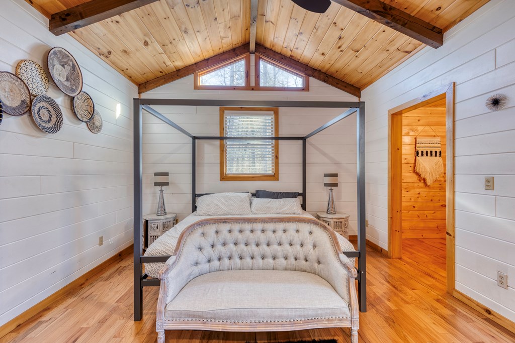 586 Newport Road Blue Ridge, GA 30513 - Photo 29 of 38 a bedroom with a bed and a window