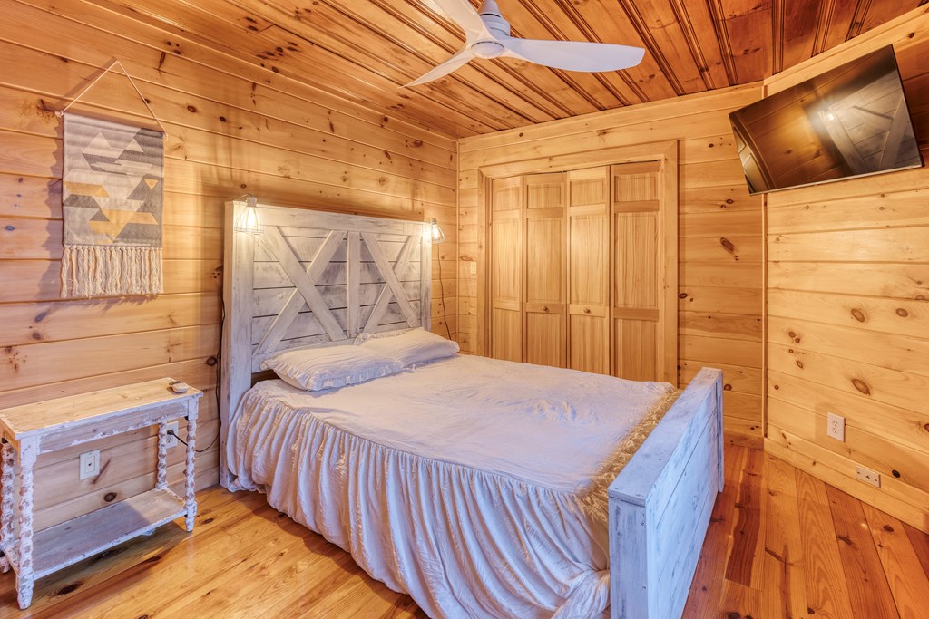 586 Newport Road Blue Ridge, GA 30513 - Photo 34 of 38 a bedroom with a bed and a window