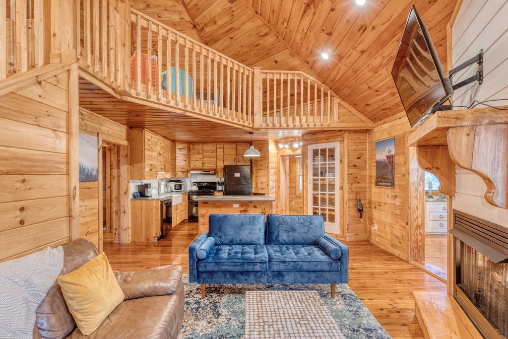 586 Newport Road Blue Ridge, GA 30513 - Photo 35 of 38 a view of a patio with couches table and chairs and potted plants