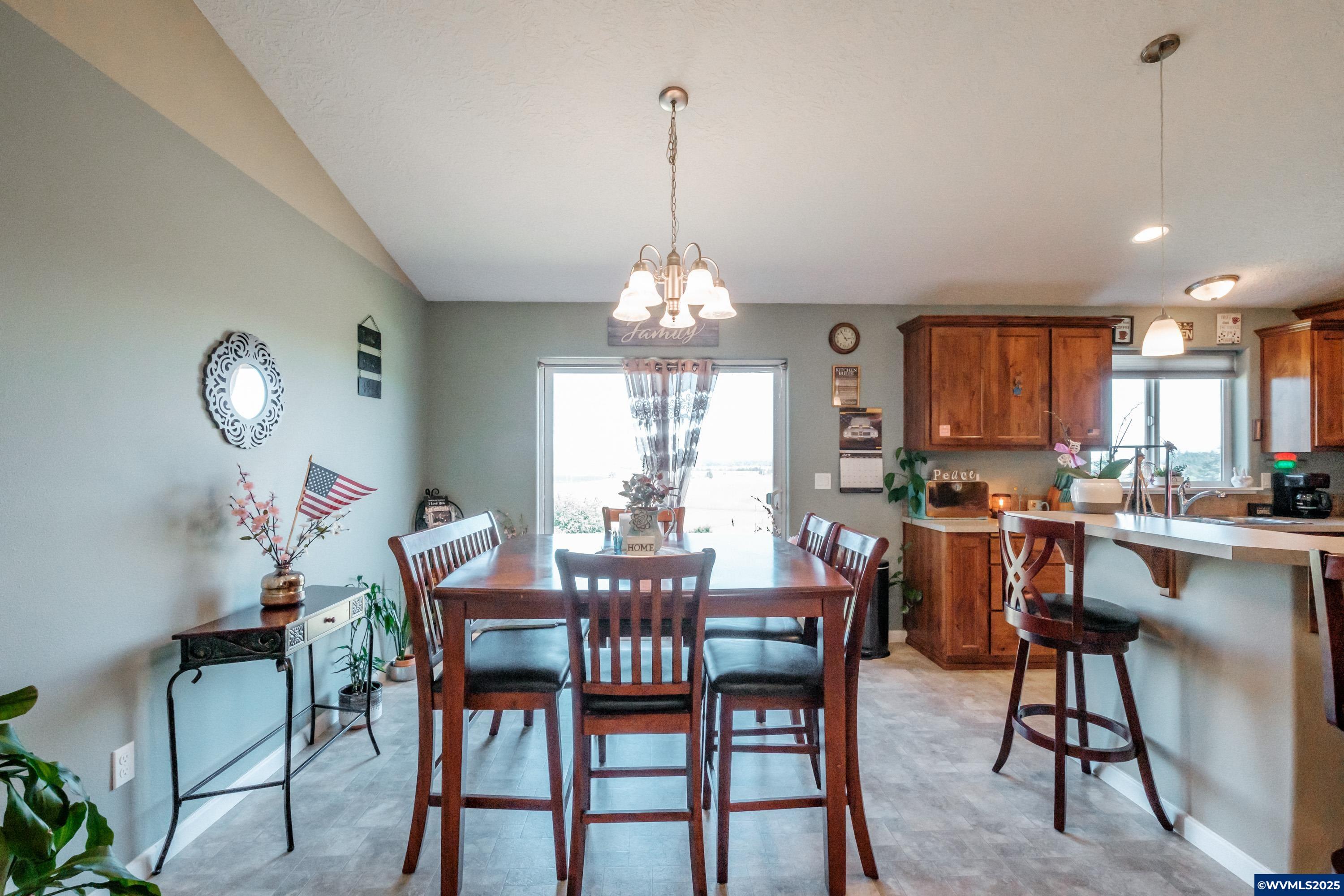 12433 Summit Loop Road Southeast Turner, OR 97392 - Photo 10 of 41 a view of a dining room and livingroom view