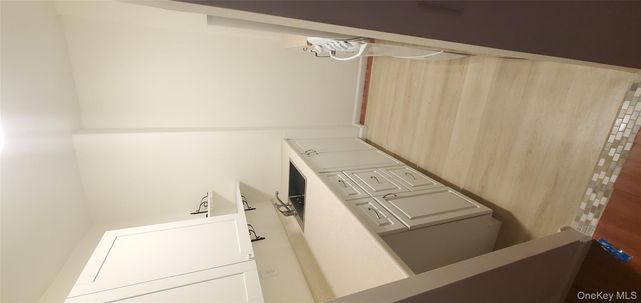 42 Pine Street, Unit 2E Yonkers, NY 10701 - Photo 14 of 24 a bathroom with a sink and a mirror