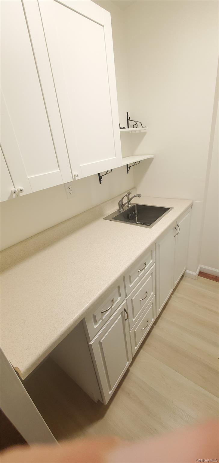 42 Pine Street, Unit 2E Yonkers, NY 10701 - Photo 15 of 24 a bathroom with a sink and a mirror