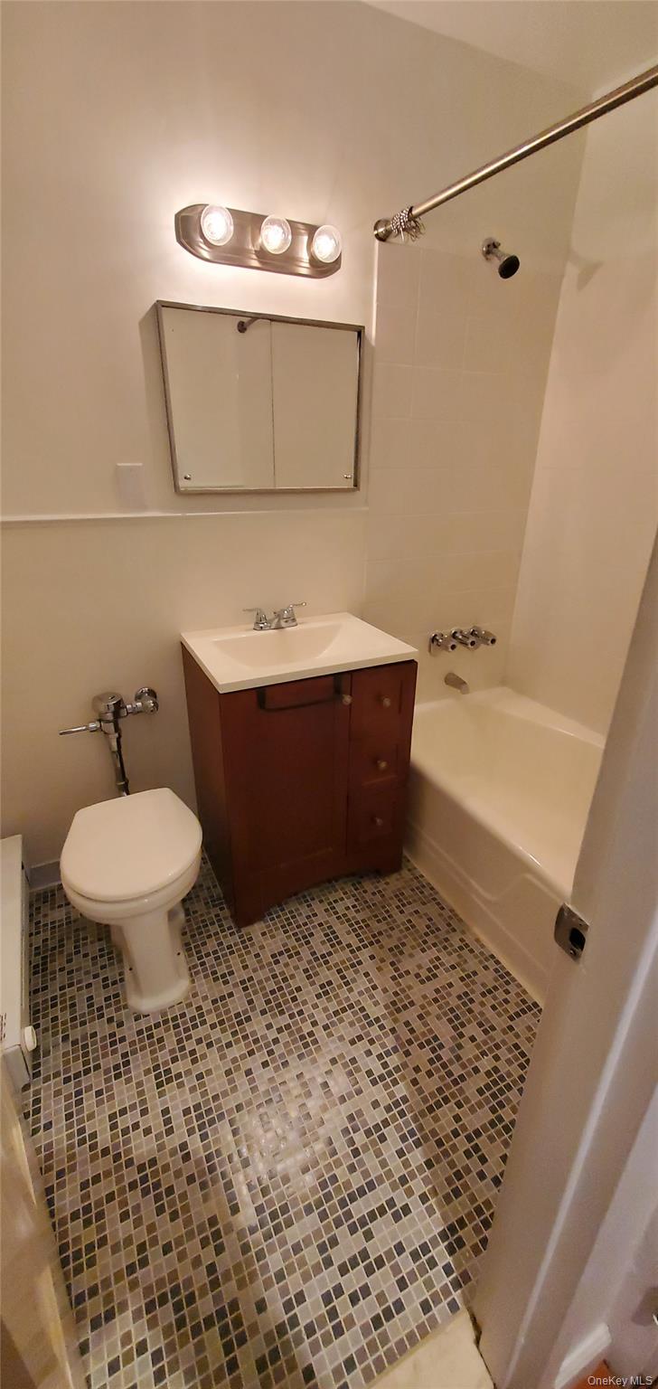 42 Pine Street, Unit 2E Yonkers, NY 10701 - Photo 8 of 24 a bathroom with a sink a toilet and shower