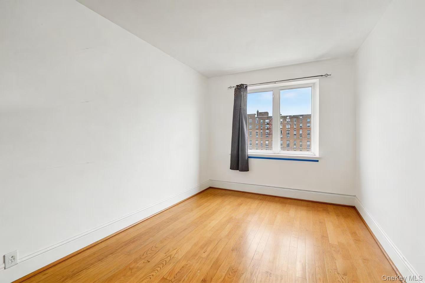 57-50 Granger Street, Unit 3A Queens, NY 11368 - Photo 13 of 20 an empty room with a window