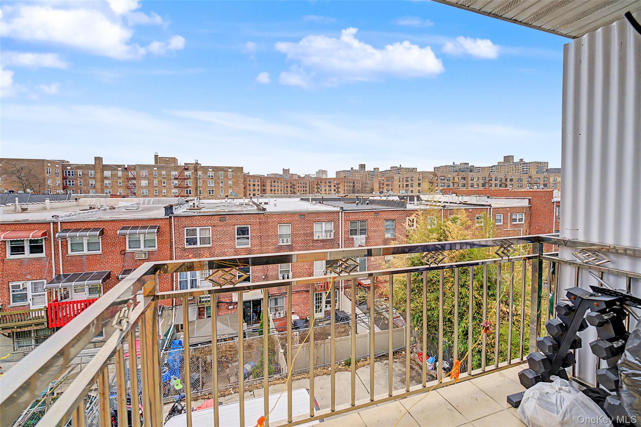 57-50 Granger Street, Unit 3A Queens, NY 11368 - Photo 16 of 20 a view of a balcony with city view