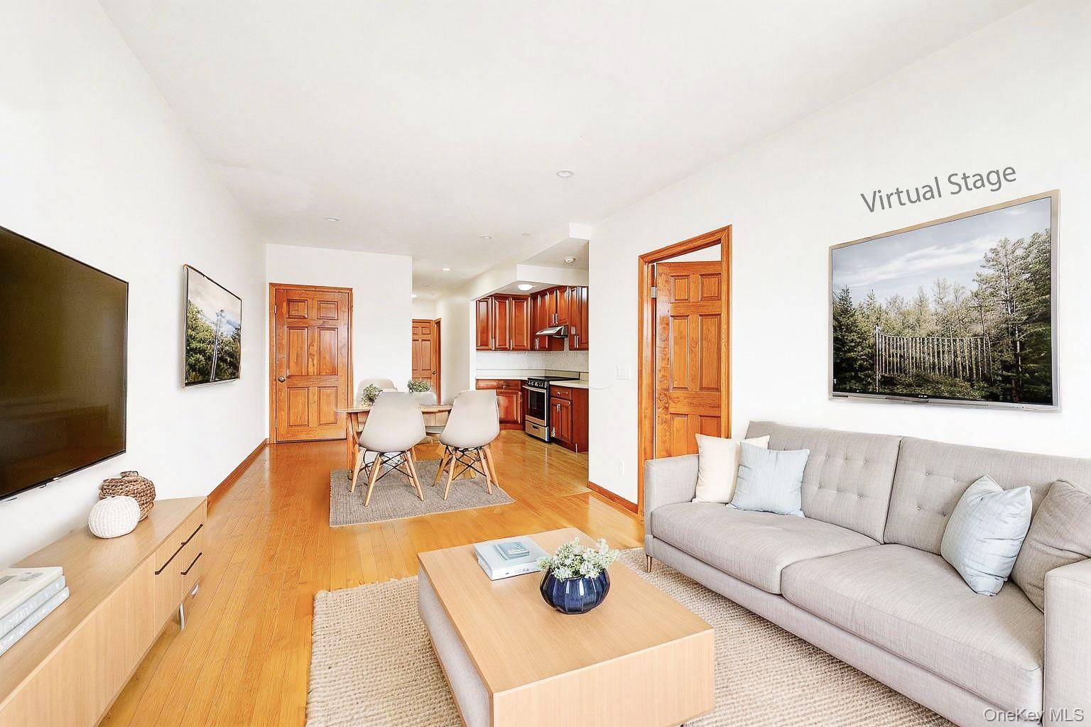 57-50 Granger Street, Unit 3A Queens, NY 11368 - Photo 4 of 20 a living room with furniture and a flat screen tv