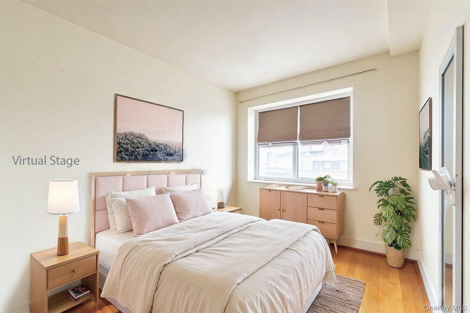 57-50 Granger Street, Unit 3A Queens, NY 11368 - Photo 10 of 20 a bedroom with a bed and a potted plant