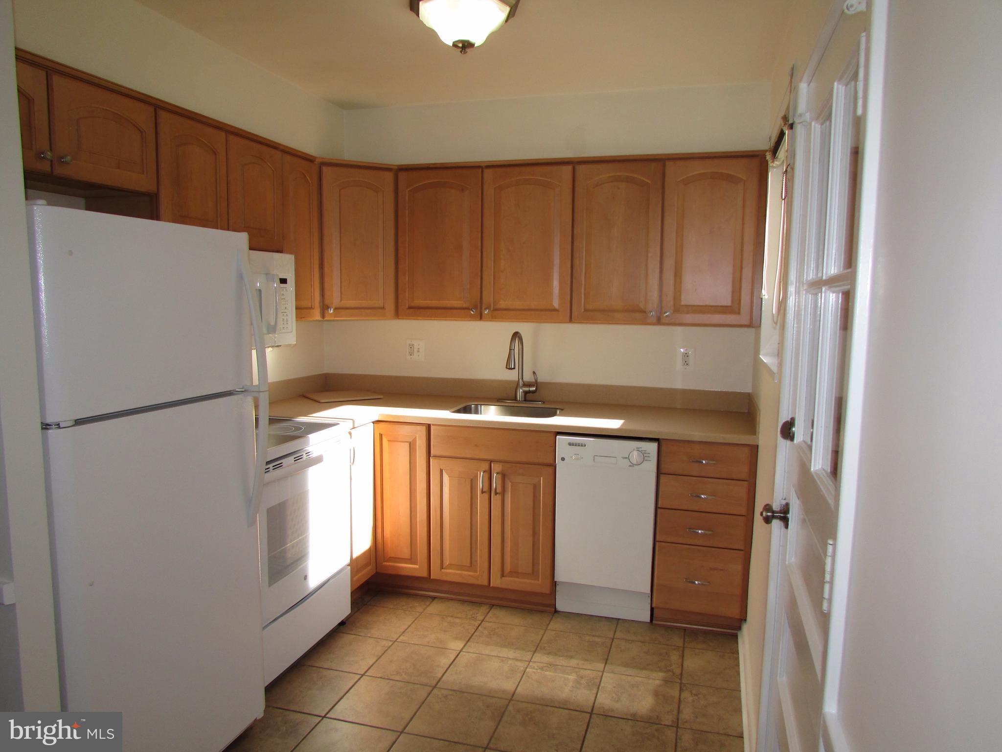 3918 Weller Road Silver Spring, MD 20906 - Photo 6 of 30 Kitchen w/ ceramic tiles & new appliances