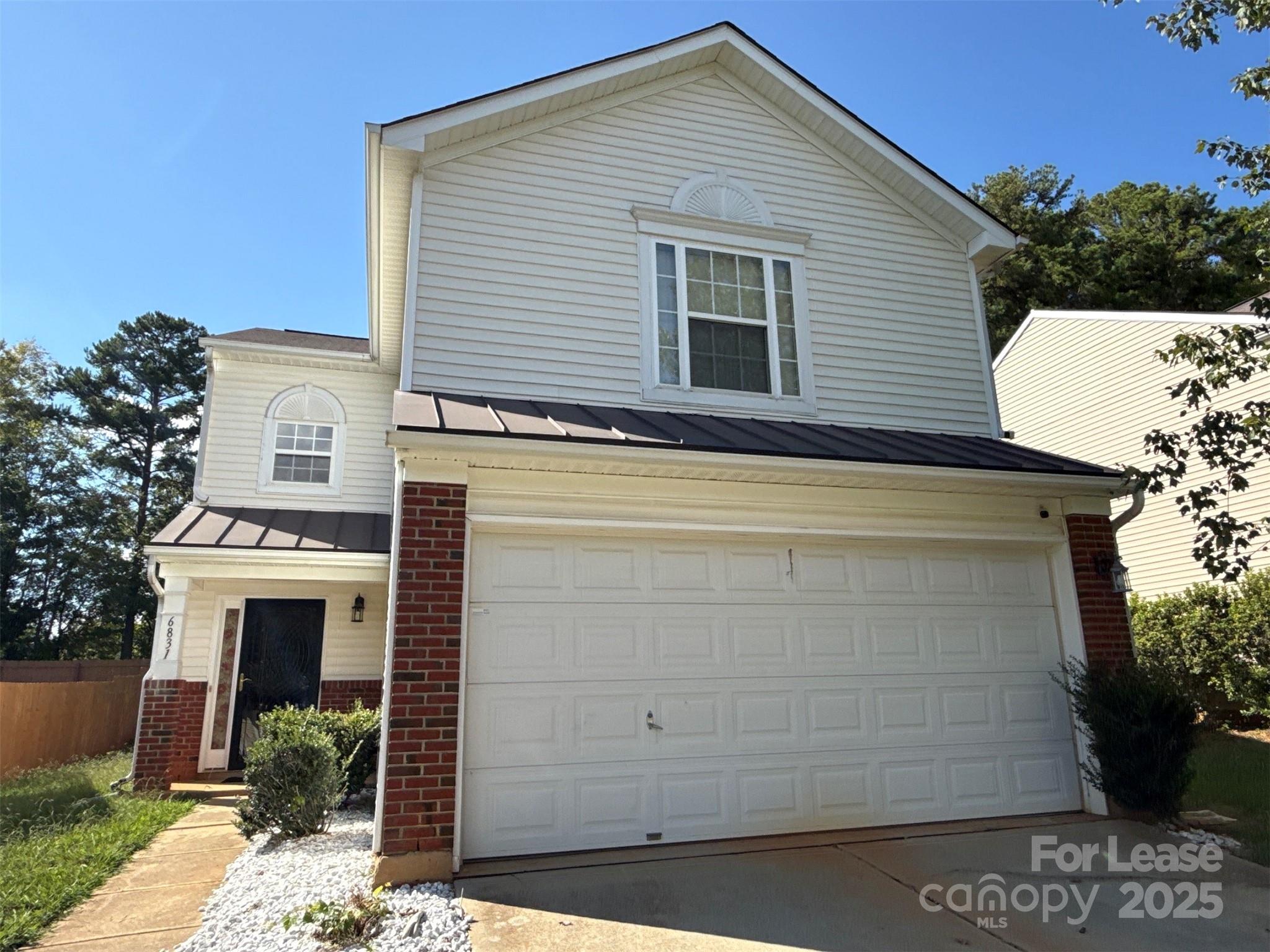 a view of a house with a garage