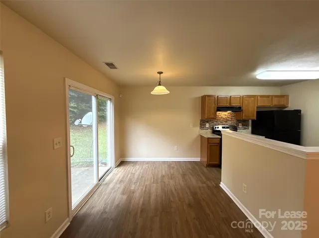 a view of kitchen with wooden floor