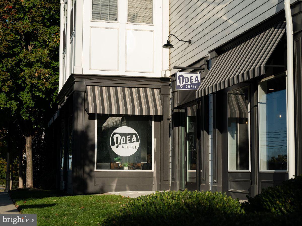 104 Merchant Avenue, Unit BROMLEY Mount Joy, PA 17552 - Photo 26 of 33 a front view of a house with a yard and garage