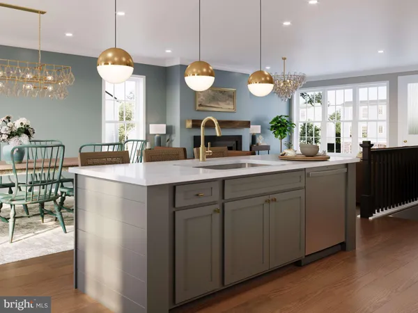 a kitchen with counter top space and living room view
